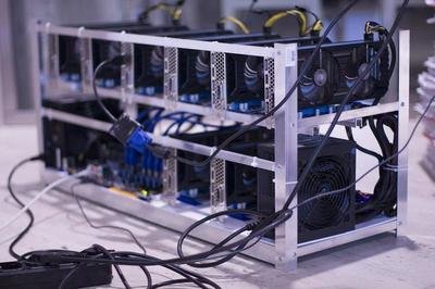 Vast cryptocurrency mining farm with rows of active miners