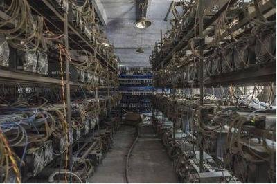 A modern Bitcoin mining farm with rows of machines operational